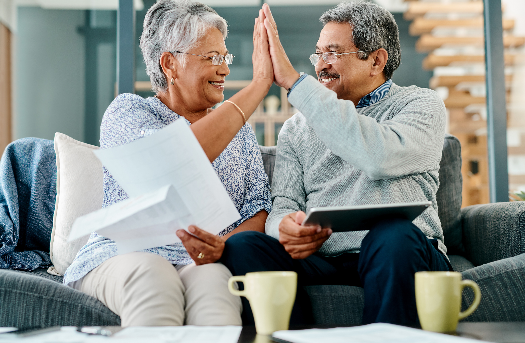 Scranton Gold IRA Investing Company getty couple high five happy